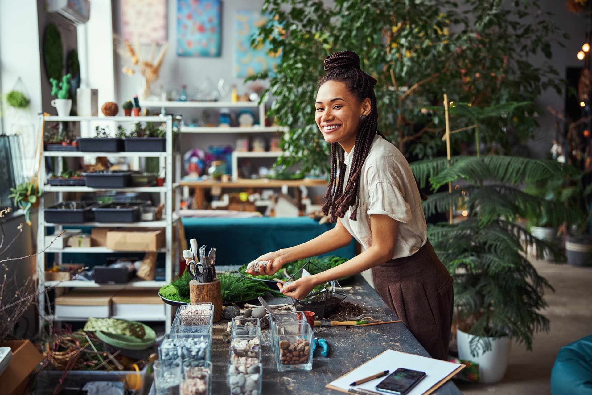 woman arranging plants at table with planting supp 2026 03 19 23 14 18 utc (1)
